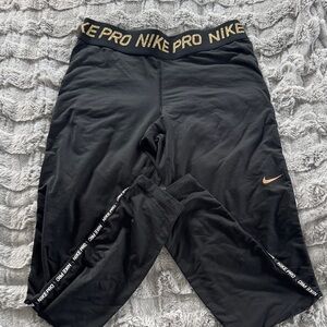 Women’s Nike Pro Black and Gold Leggings